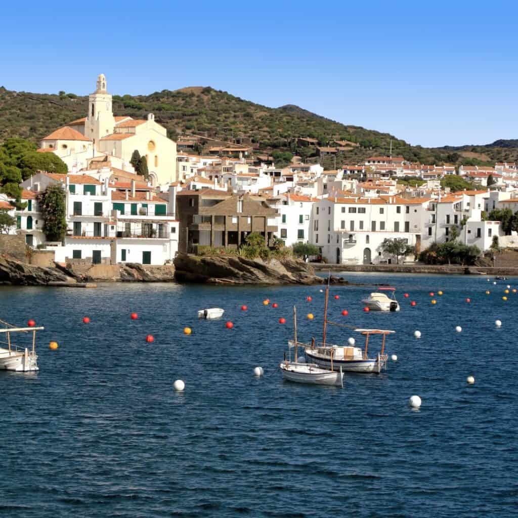 Cadaqués, a small port with white houses and orange roofs in catalonia, spain