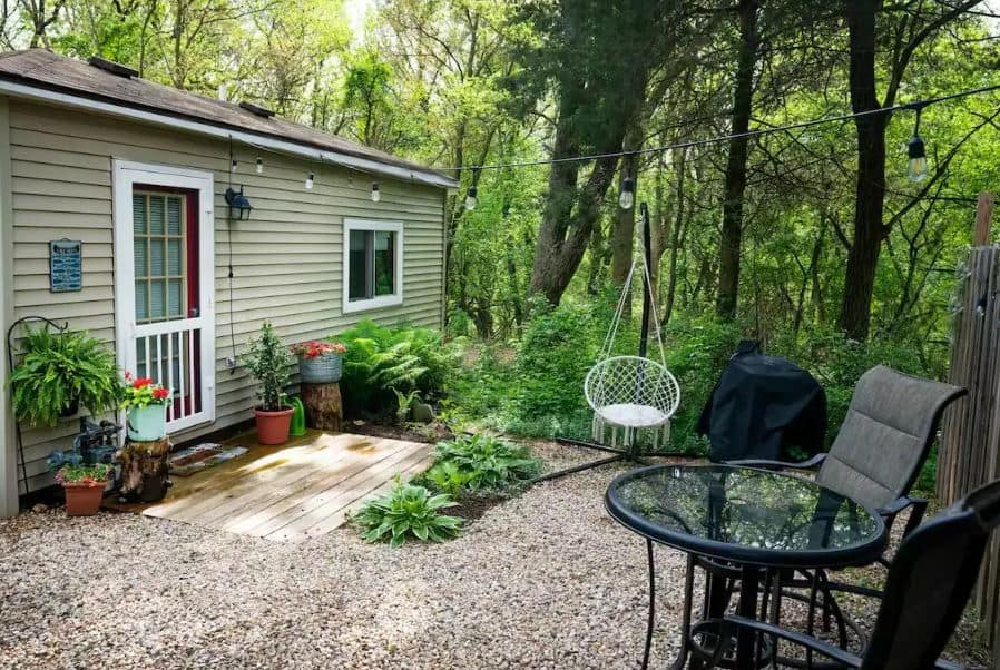 exterior of the The Tiny Bay House in Williams Bay, Wisconsin with small garden in nature