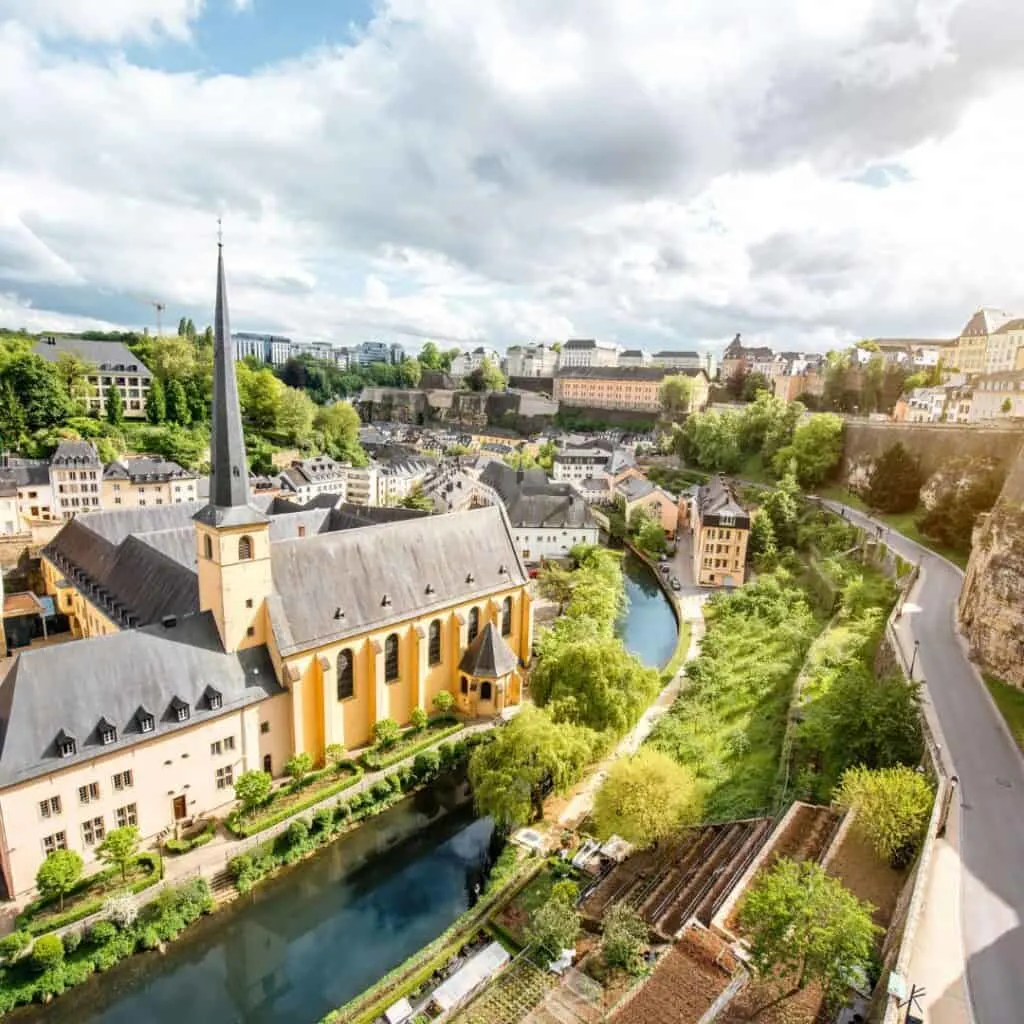 luxembourg city old town, top view on the grund district with st. john's church and neumunster abbey