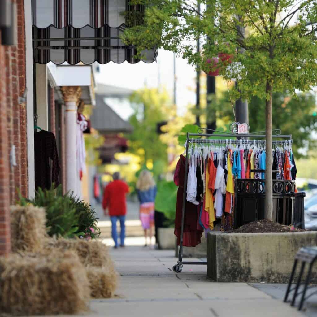 looking down sidewalk in downtown shopping district, things to do in lake geneva in june