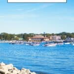 Pinterest pin about things to do in Lake Geneva showing blue lake waters, a smooth paved path, and buildings in the distance during a sunny day