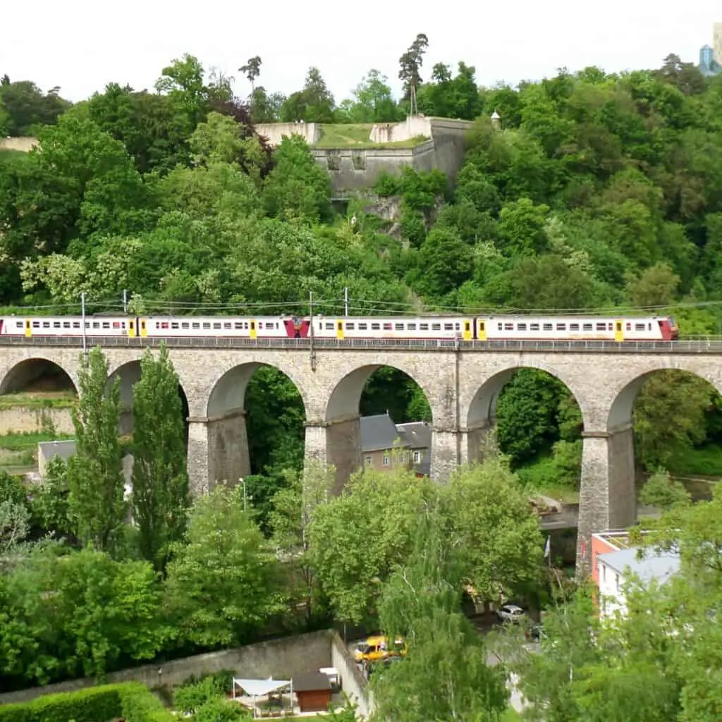 Train crossing the passarelle 24 arches viaduct in luxembourg, free transportation interesting facts about luxembourg