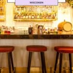 a bar with red stools and gold accent rustic and industrial