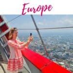 travel blogger using phone during traveling with a high of the city from atop