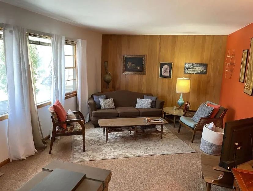 Sunny Upper Flat in Milwaukee with sofa, TV and a lot of natural light.
