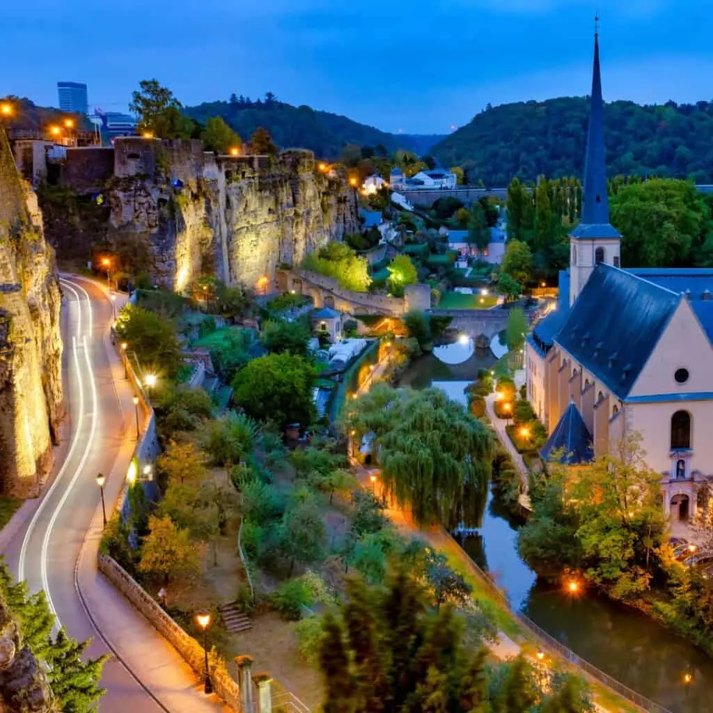 Nighttime view of Luxembourg City from Corniche with the Neumünster Abbey in the foreground