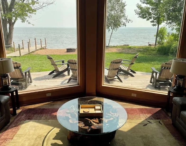 living room with lakeview at the Chalet with Private Sandy Beach in Washburn, Wisconsin