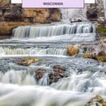 waterfalls going through a body of water with brown and black rocks