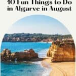 Pinterest pin about Algarve in August showing a photo of a sandy beach with towering cliffs and rock formations, including a blue ocean with whitecaps on the waves, and a clear blue sky.