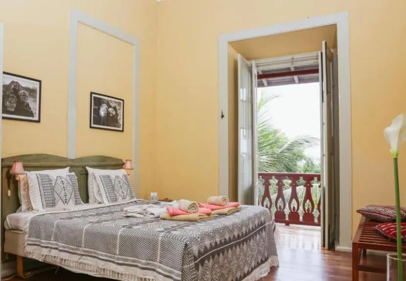 cozy bedroom with balcony at The Colonial Guest House in Sao Filipe Fogo Island Cape Verde - 12 Fantastic Boutique Hotels in Cape Verde