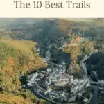 Pinterest pin about hiking in Luxembourg showing aerial view of Esch-sur-Sure small town