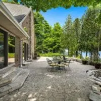 outdoor sitting area with table and chairs and lake view at Exceptional Lake Michigan Waterfront cabin in Door County, Wisconsin, unique places to stay in door county