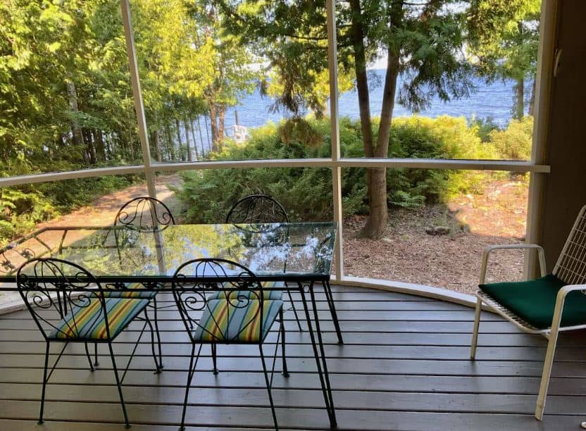 porch with sitting table and lake view at Gray Gull Cottage in Door County, Wisconsin