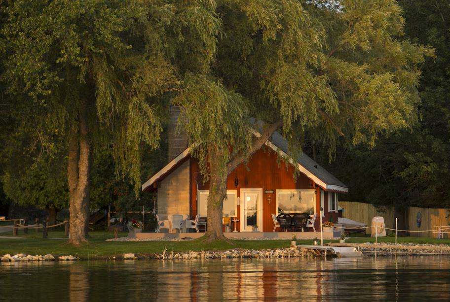 the Door County's Chalet On The Shore in Wisconsin seen from the lake at sunset