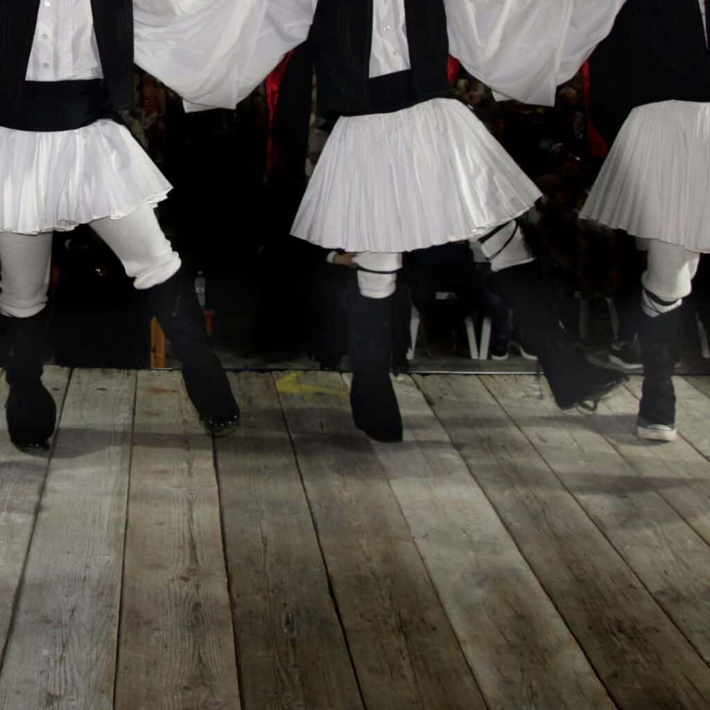 Dancers wearing traditional Greek costumes in a festival in Paros, Greece