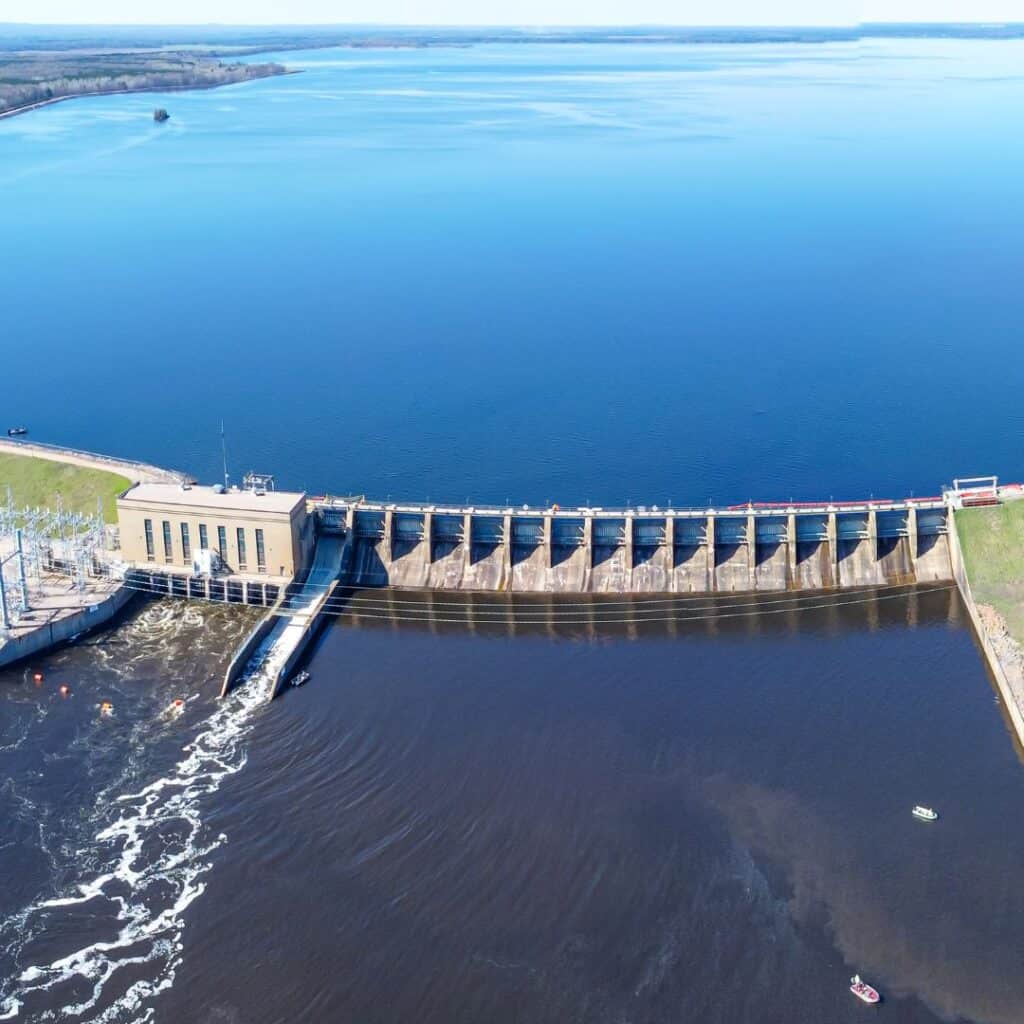 an aerial view of a dam on the water