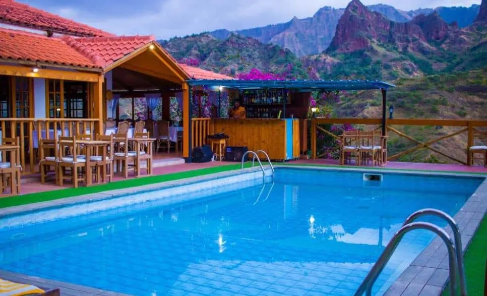 bar and restaurant by the pool with mountain view at Pedracin Village in Ribeira Grande, Cape verde