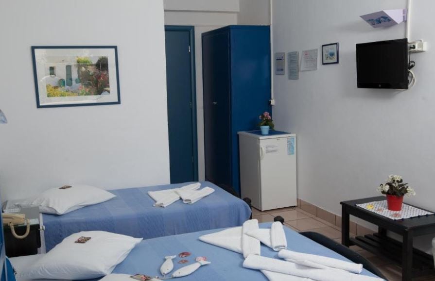 bedroom with 2 separate beds at Dilion Hotel in Paros, Greece