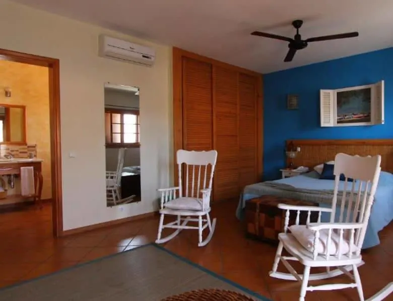 bedroom with a bed, 2 chairs at Kira's Boutique Hotel in Mindelo, Cape verde