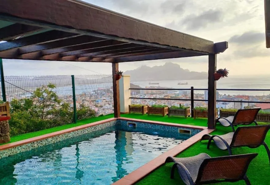 rooftop pool with lounges and sea view at Pombas Brancas Hotel in Mindelo, Cape Verde, Best Hotels in Mindelo