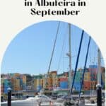 A colorful marina in Albufeira, Portugal, with several sailboats docked at the pier. The buildings in the background are brightly painted in various colors. The text on the image reads 