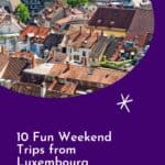 A Pinterest pin promoting Paulina on the Road's article about 10 Fun Weekend Trips from Luxembourg. The image features an aerial view of Freiburg im Breisgau, Germany, with red-tiled roofs, a clock tower, and lush green hills in the background.