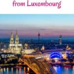 A Pinterest pin promoting weekend trips from Luxembourg. The image features a stunning night view of Cologne, Germany, showcasing the illuminated Cologne Cathedral, Hohenzollern Bridge, and the city skyline.