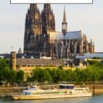 A Pinterest pin promoting weekend trips from Luxembourg. The image features Cologne Cathedral, a majestic Gothic cathedral towering over the city of Cologne, Germany. A riverboat is docked in the foreground.