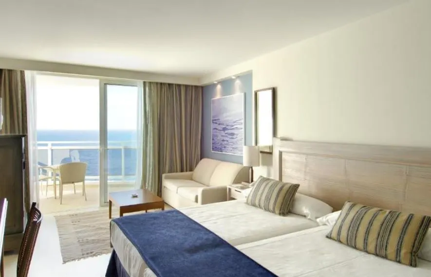 bedroom with balcony overlooking the sea at Hotel Tenerife Golf & Seaview in San Miguel de Abona, Tenerife