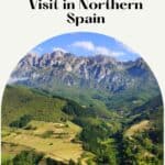 A scenic landscape in Northern Spain featuring a valley with rolling green hills, mountains in the distance, and a small village nestled among the trees. The text 