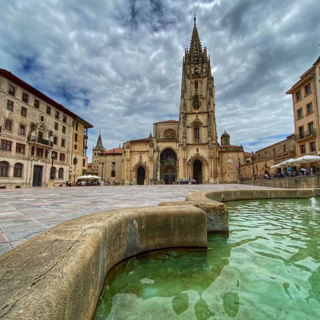 The Cathedral of San Salvador in Oviedo, Spain, a Gothic cathedral with a tall spire and a large square in front.