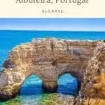 two holes on the a rock cliff on the algarve coast with clear green and blue waters