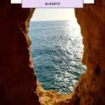 a view of the ocean through an opening in a cave