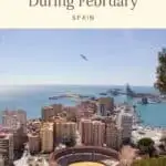 Where to go in Spain in February a view of the city of Malaga from the top of a hill with buildings by the sea and a bird flying