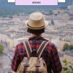 a pin with a traveler watching a city in the distance. europe coffee table books