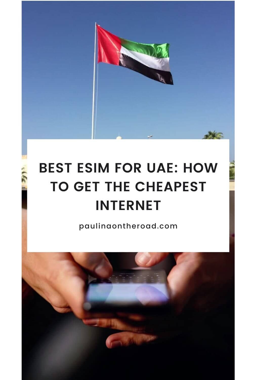a uae flag at op a building waving; a person pressing on the phone