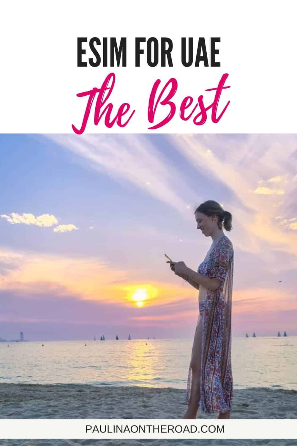 travel blogger at beach during sunset with phone