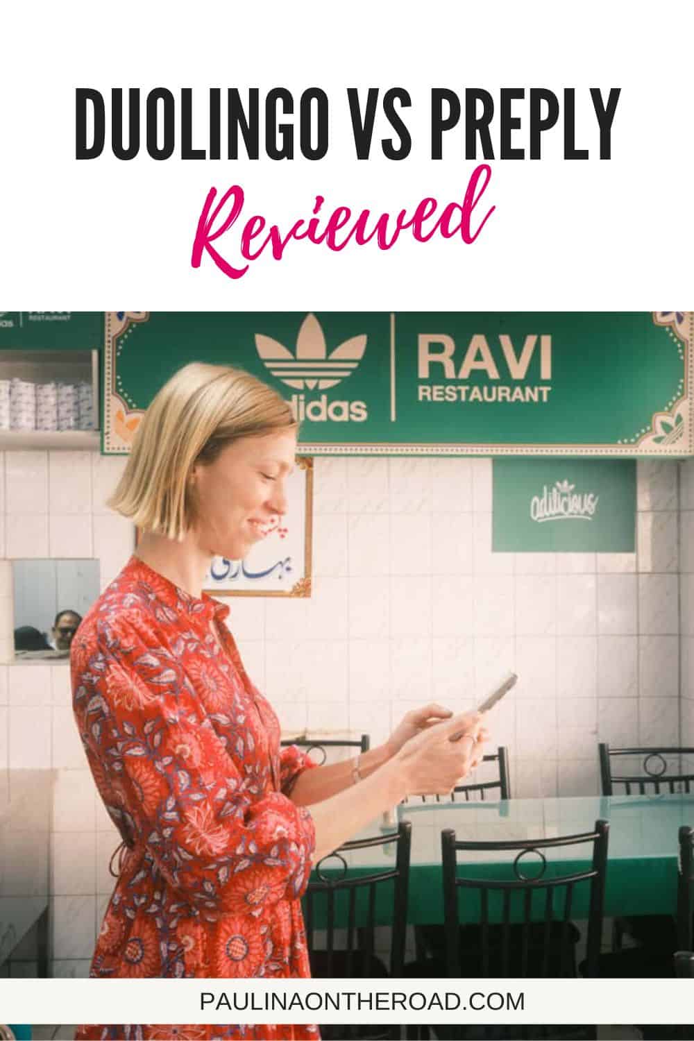 a woman looking at her phone in a restaurant